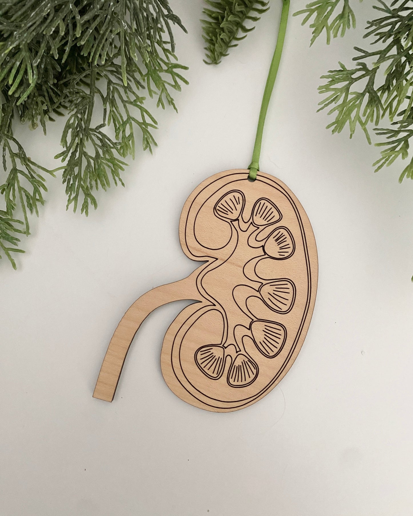 Kidney engraved wood ornament