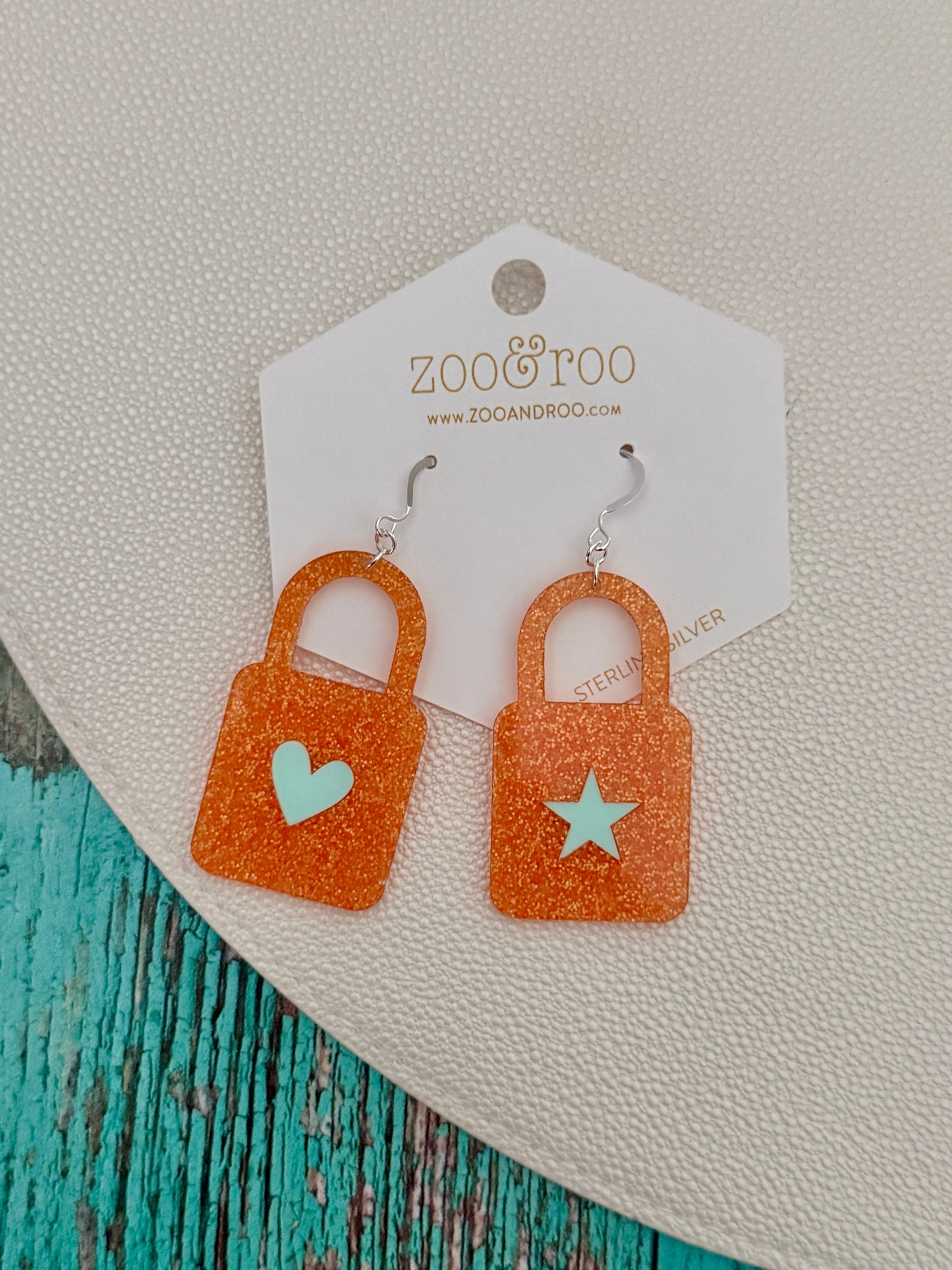 Orange glitter lock earrings with mint inlay