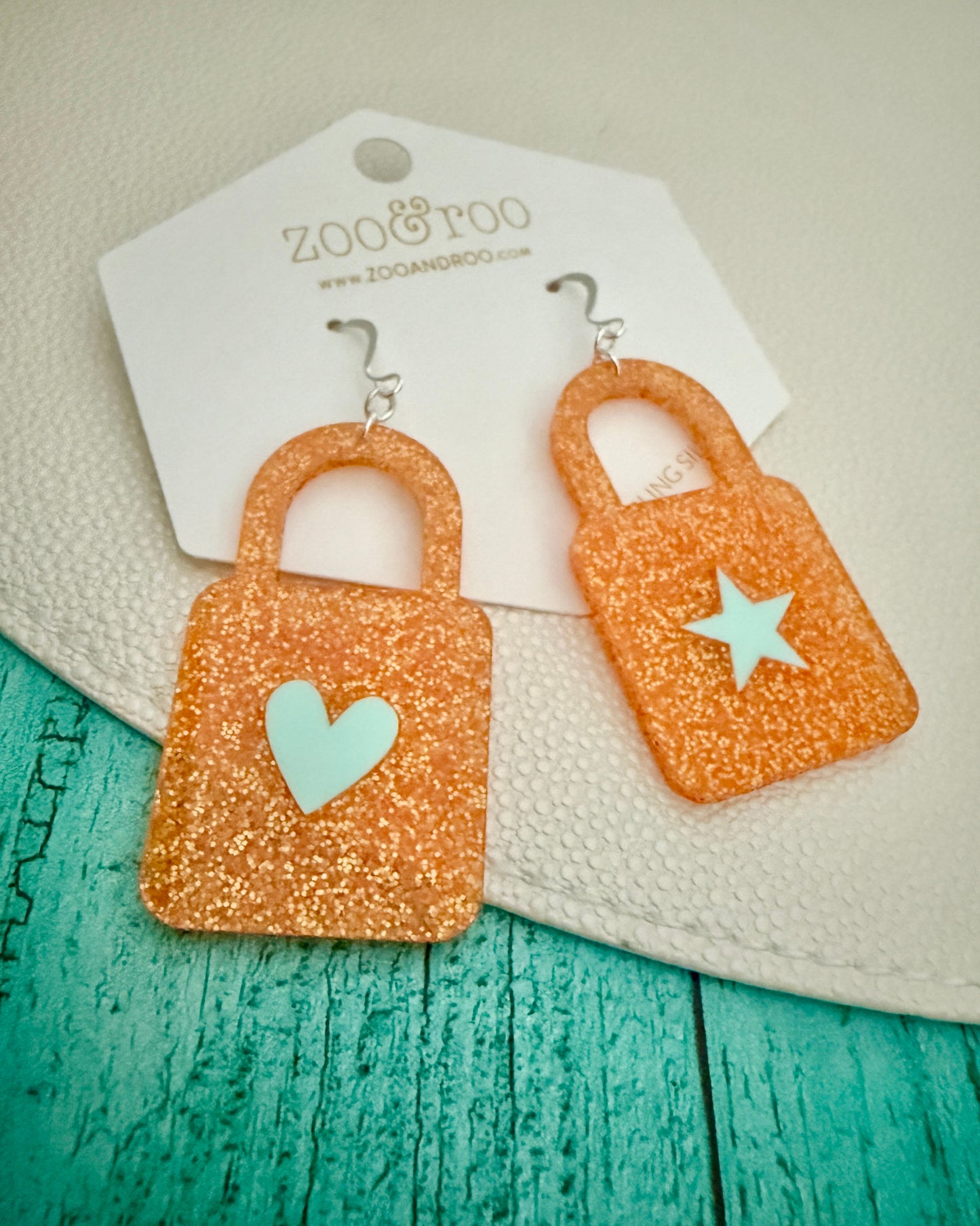 Orange glitter lock earrings with mint inlay