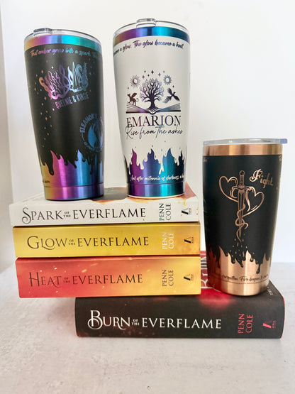 Three 20 oz Emarion tumblers in black and rainbow, white and rainbow, and black and copper, stacked on Penn Cole's Kindred's Curse Saga series