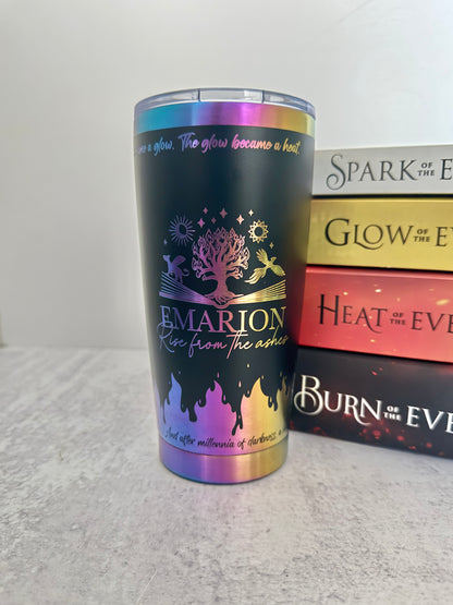 Black and rainbow iridescent 20 oz Emarion tumbler with Everflame tree, phoenix, and gryvern, beside Penn Cole's Everflame books
