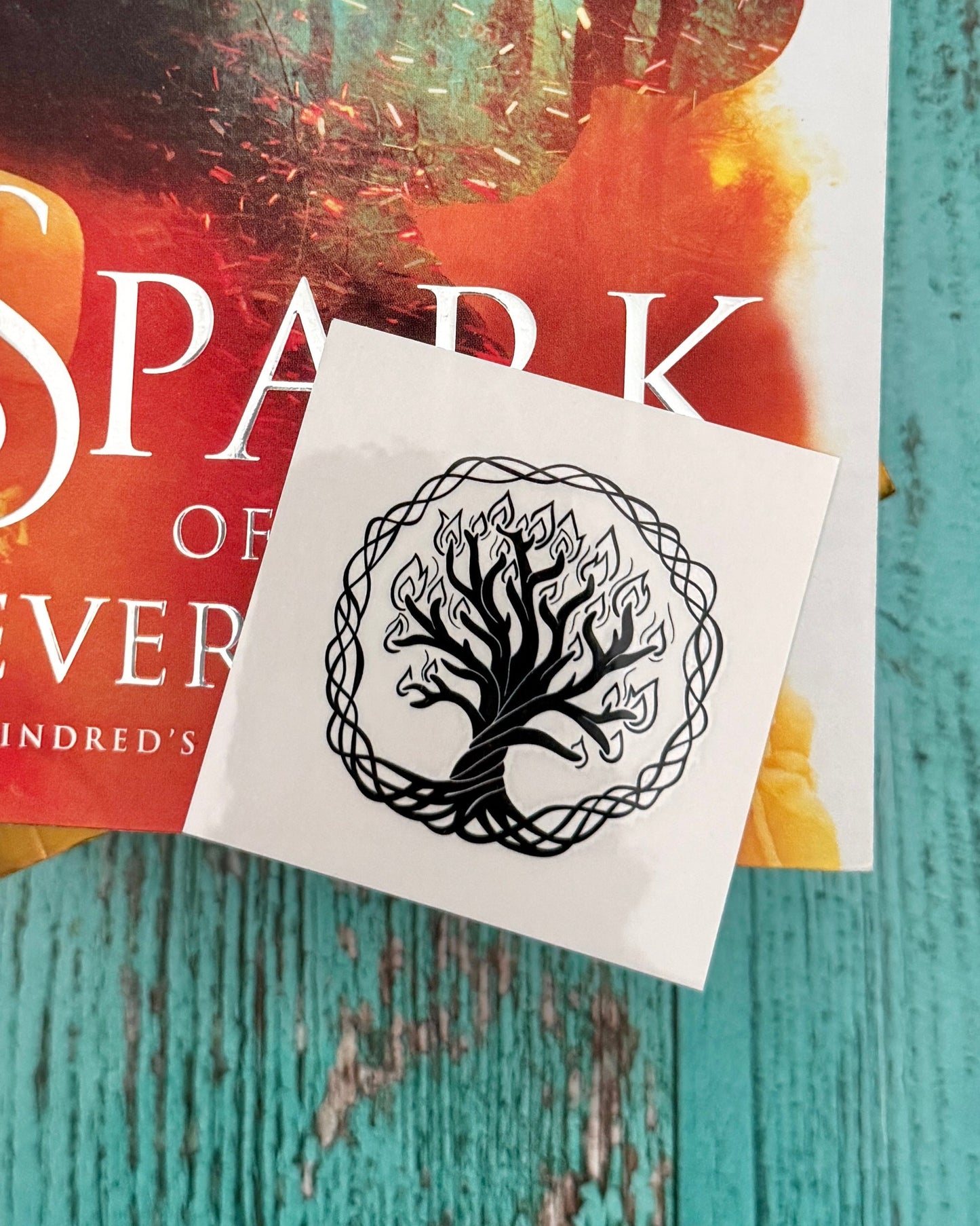 Temporary tattoo of the burning Everflame tree encircled in vines from The Kindred's Curse Saga by Penn Cole