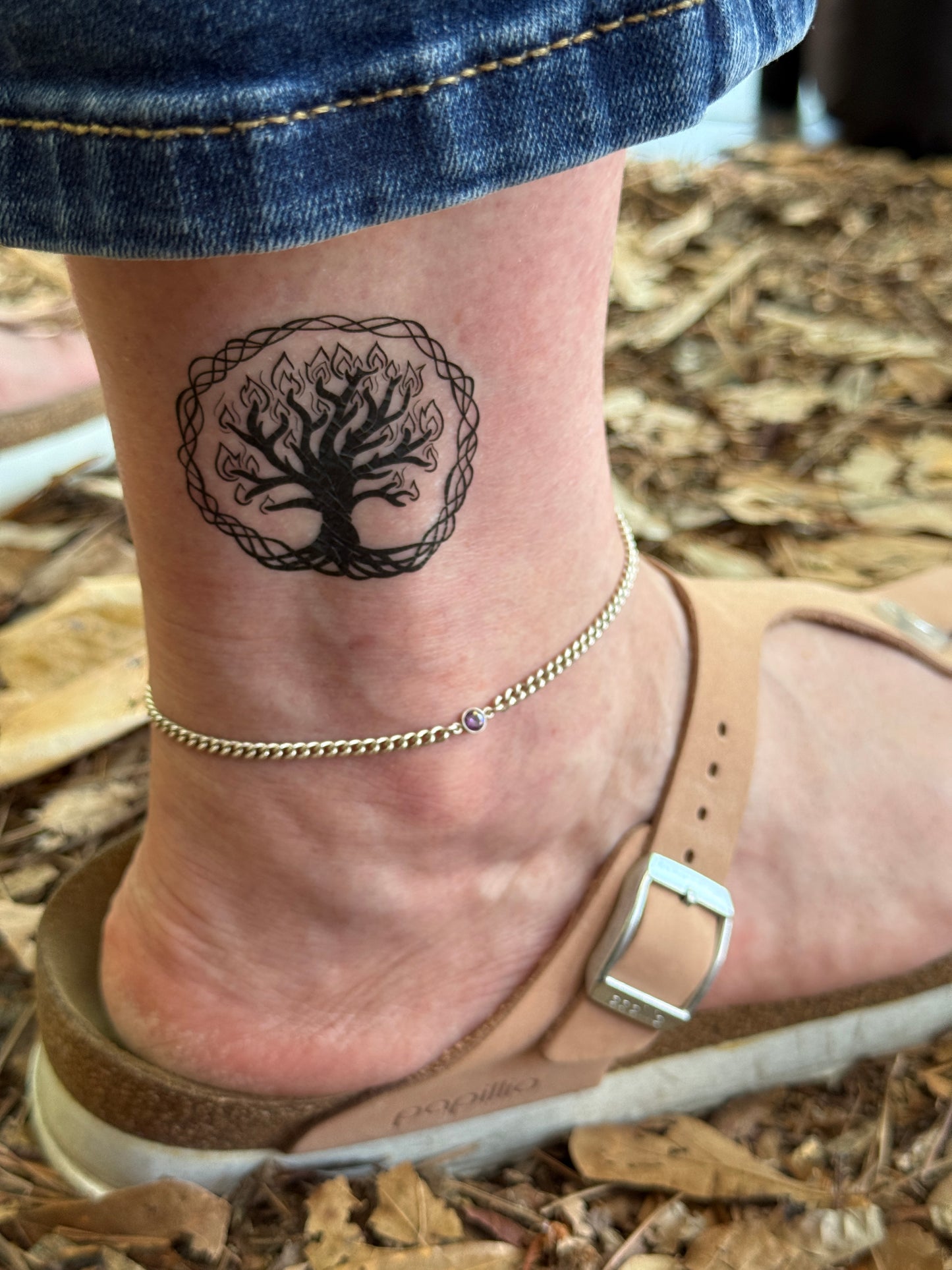 ankle tattoo of the Guardian of the Everflame symbol from Kindred's Curse Saga by Penn Cole