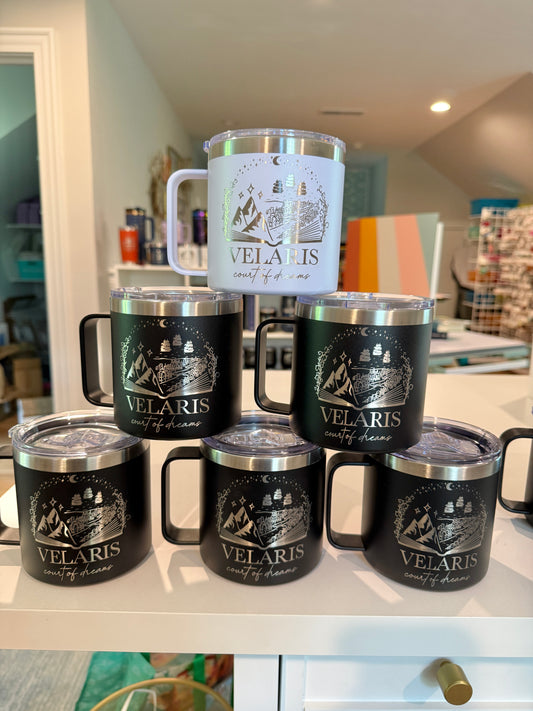 Collection of Velaris branded tumblers on a surface with a home interior background.