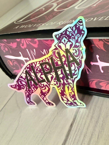 Holographic 'Alpha' wolf sticker on a copy of Dire Bound with sprayed edges.