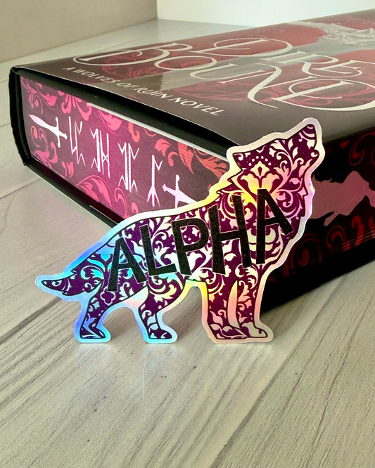 Decorative wolf shaped die cut holographic sticker with 'ALPHA' on a copy of Dire Bound