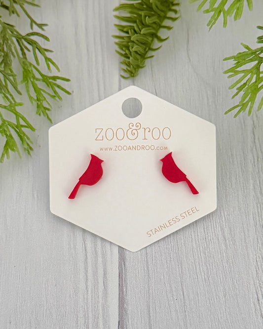 red cardinal stud earrings on white surface