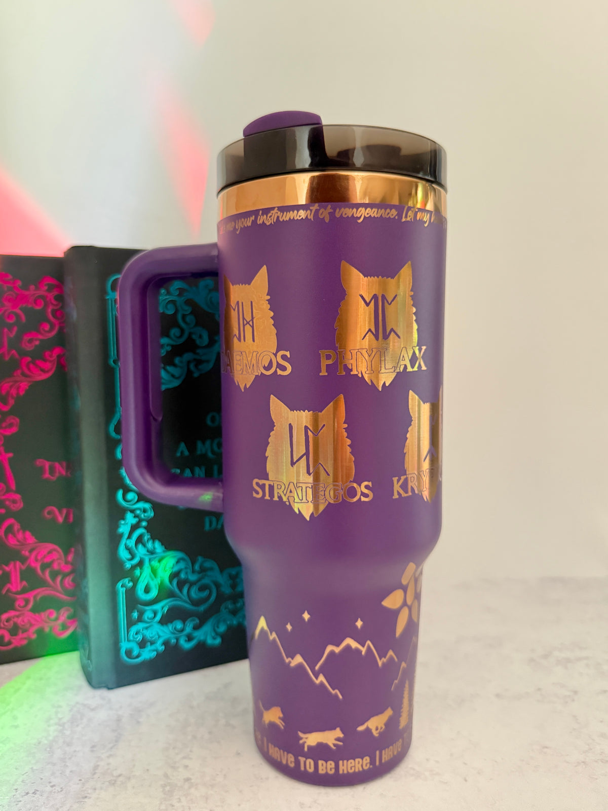 Purple 40 oz Dire Bound inspired tumbler with gold-engraved wolf pack symbols for Daemos, Phylax, Strategos and Kryptos