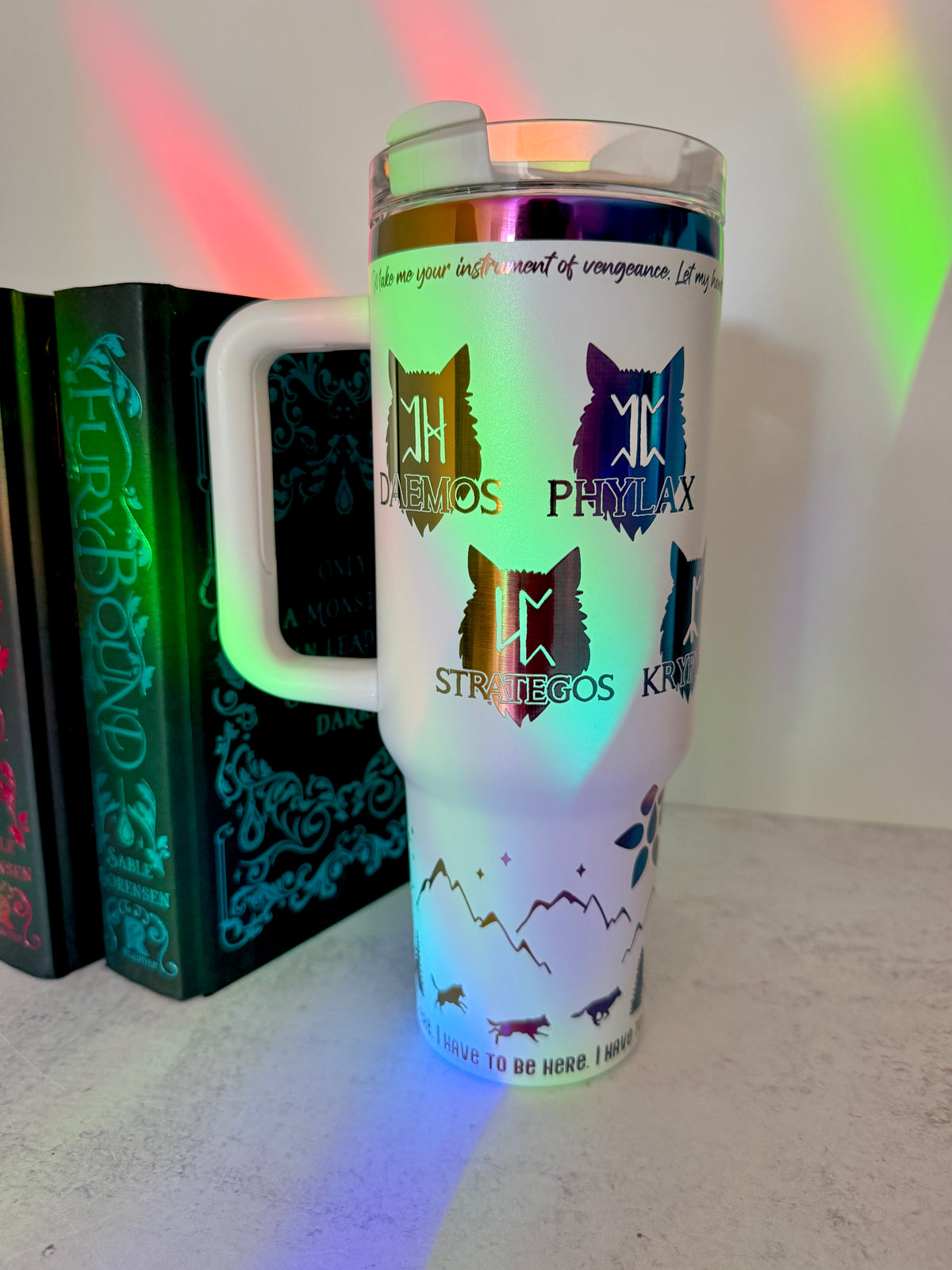 White 40 oz Dire Bound inspired tumbler with rainbow-engraved wolf pack symbols for Daemos, Phylax, Strategos and Kryptos