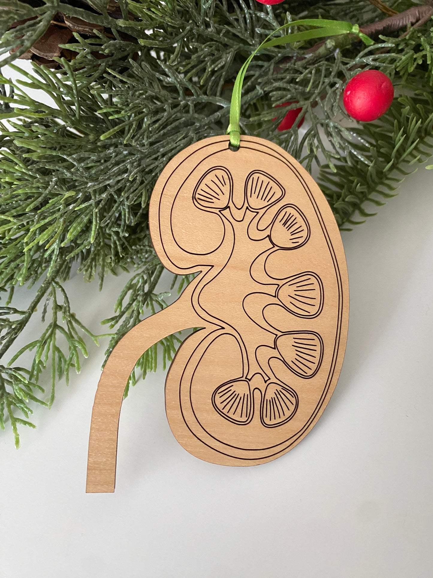 Kidney engraved wood ornament