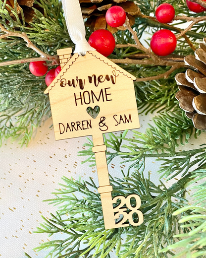 Decorative key ornament with a house on the top and 'our new home' text engraved and personalized with names and year