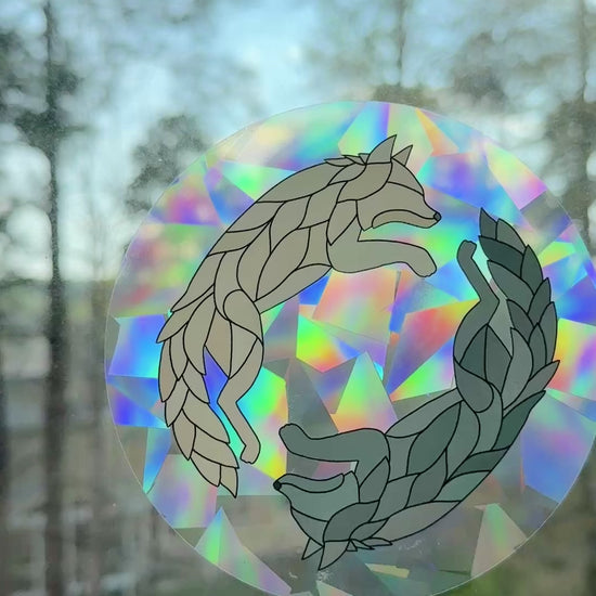 Video of a holographic wolf decal on a window