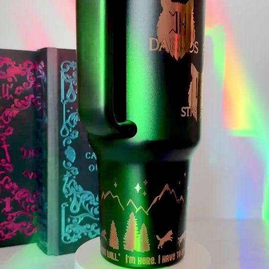 Black 40 oz Dire Bound inspired tumbler with a gold-engraved Nocturna castle, mountains, wolves and pack symbols Daemos, Strategos, Phylax and Kryptos