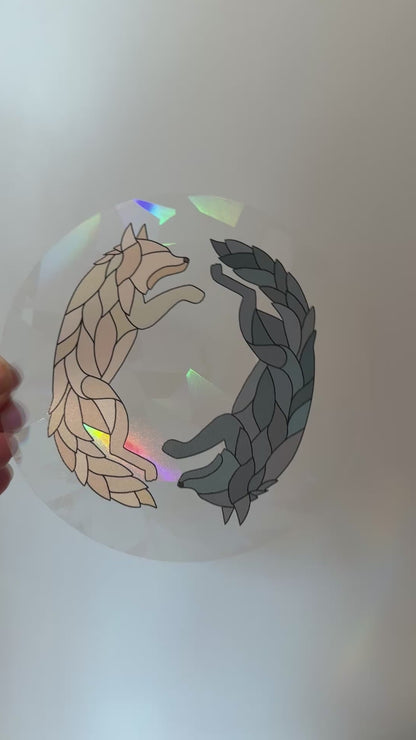 Video of a holographic wolf suncatcher decal sticker inspired by Dire Bound