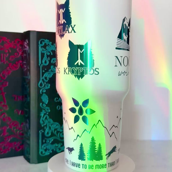 White 40 oz Dire Bound inspired tumbler with rainbow-engraved Nocturna castle, mountains, wolves and wolf pack symbols for Daemos, Strategos, Phylax and Kryptos