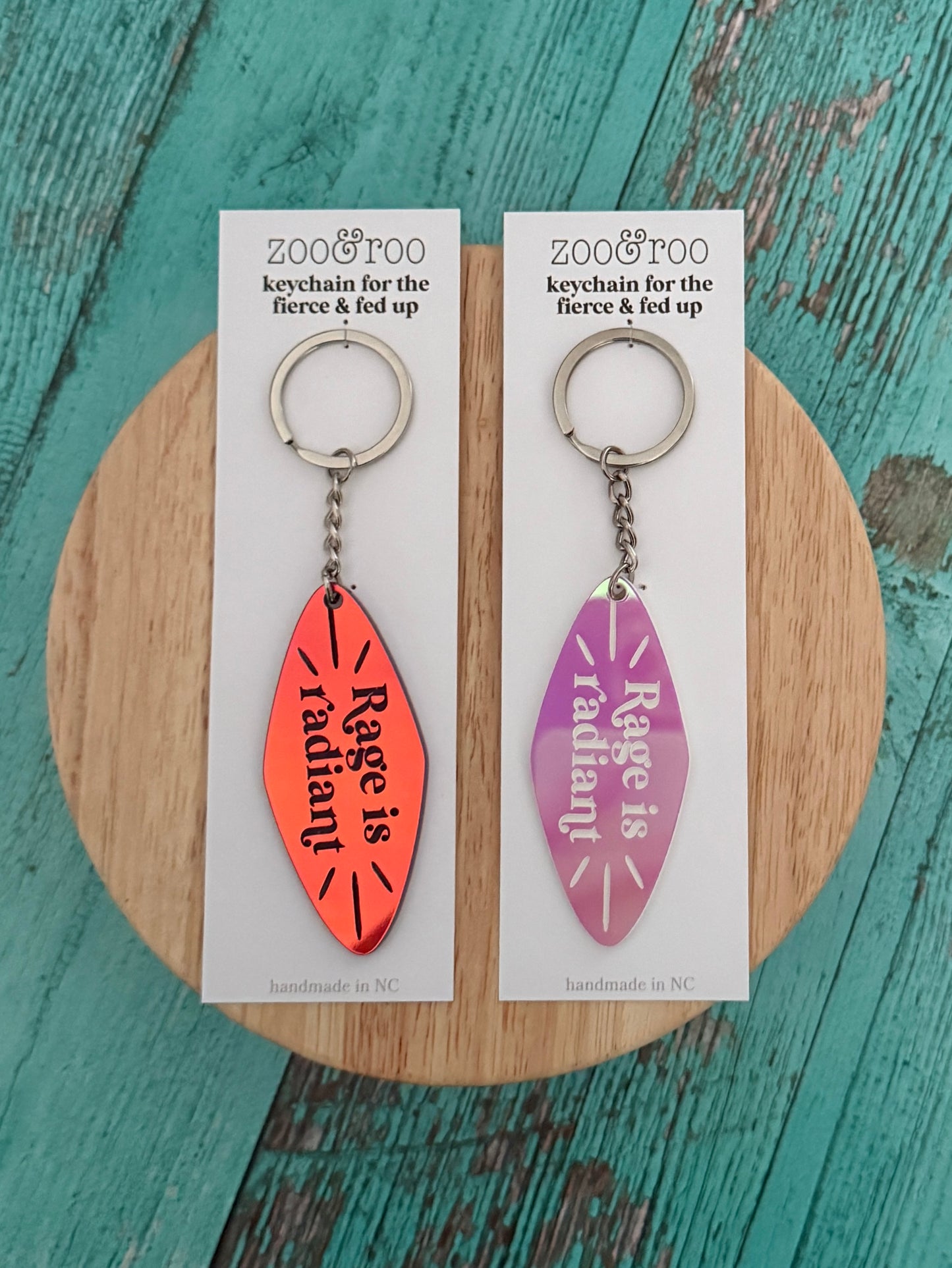 Rage is radiant handmade iridescent keychains in packaging by zoo&roo
