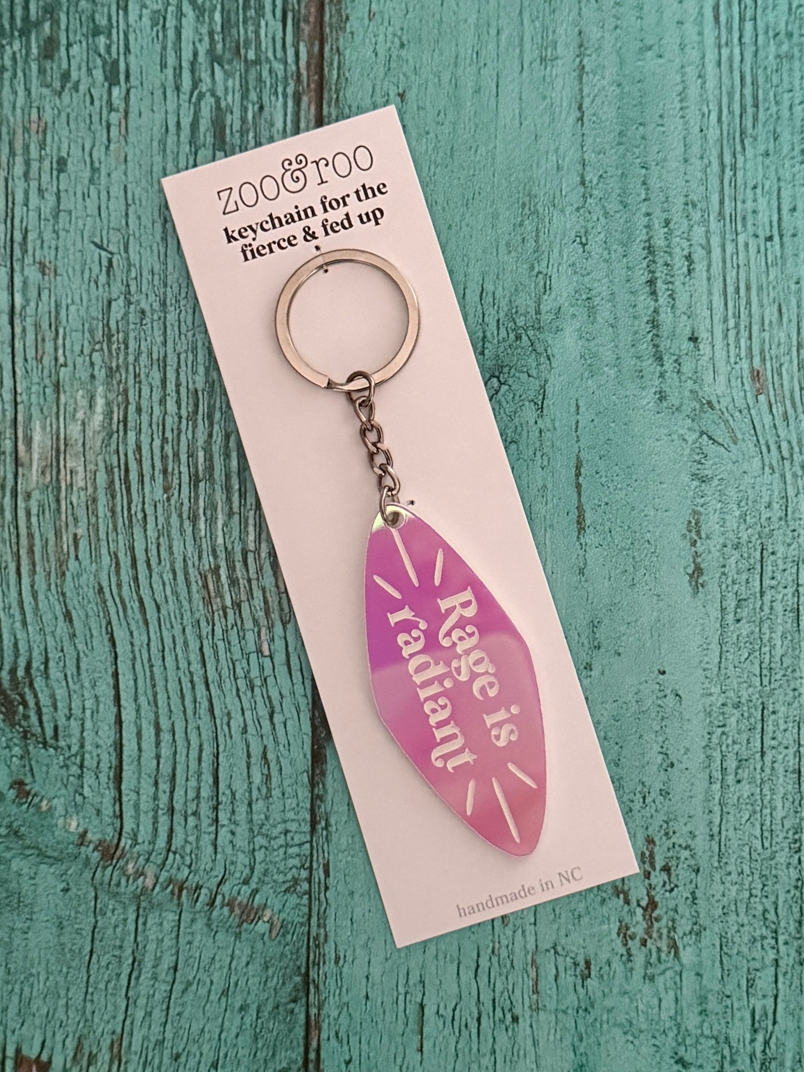Rage is radiant handmade keychain pink iridescent acrylic in packaging
