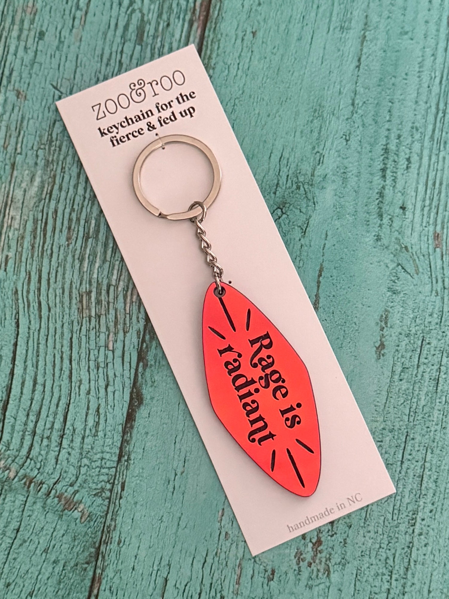 Rage is radiant handmade keychain sunset iridescent acrylic in packaging by zoo&roo