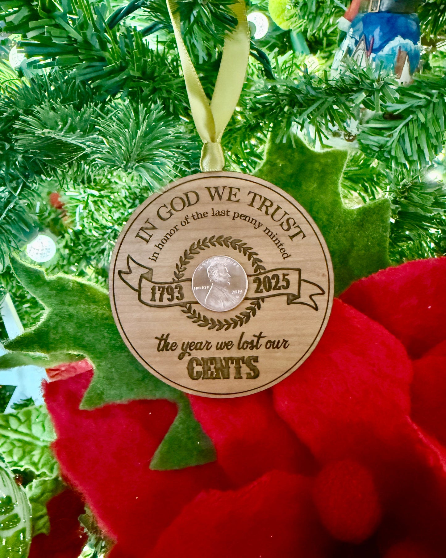 Wooden Christmas ornament with penny design on a tree